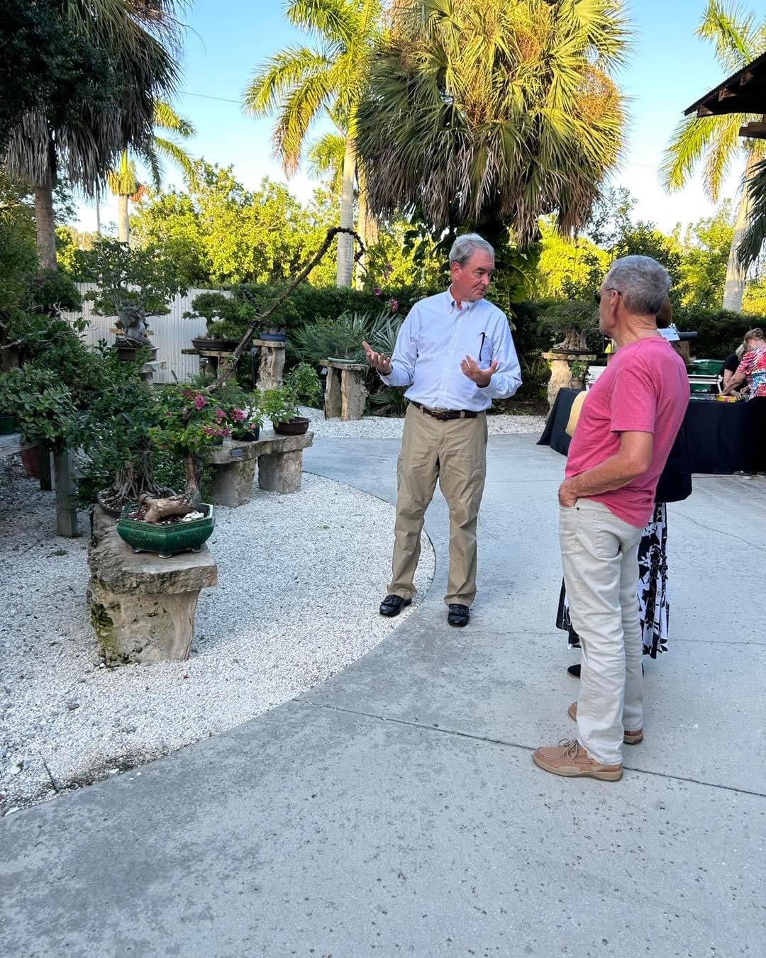 Tom with guests and tree talking 2023